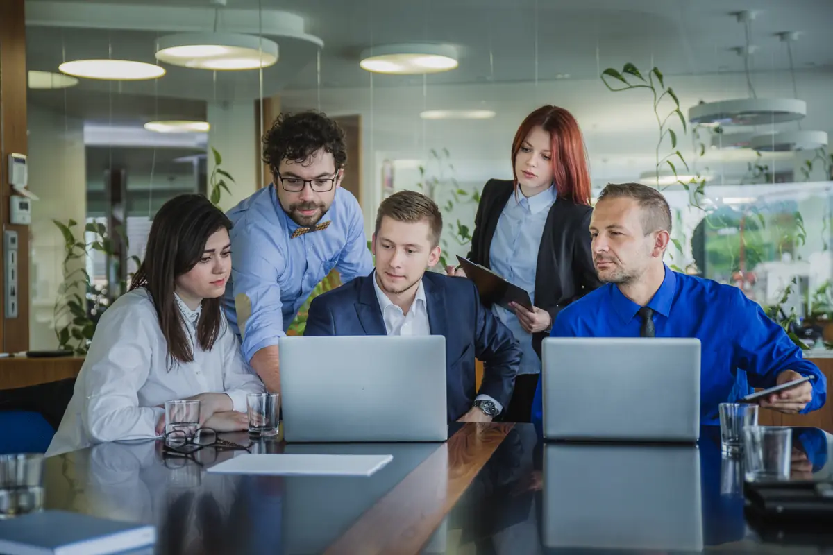 Consultants discussing tech plans in office